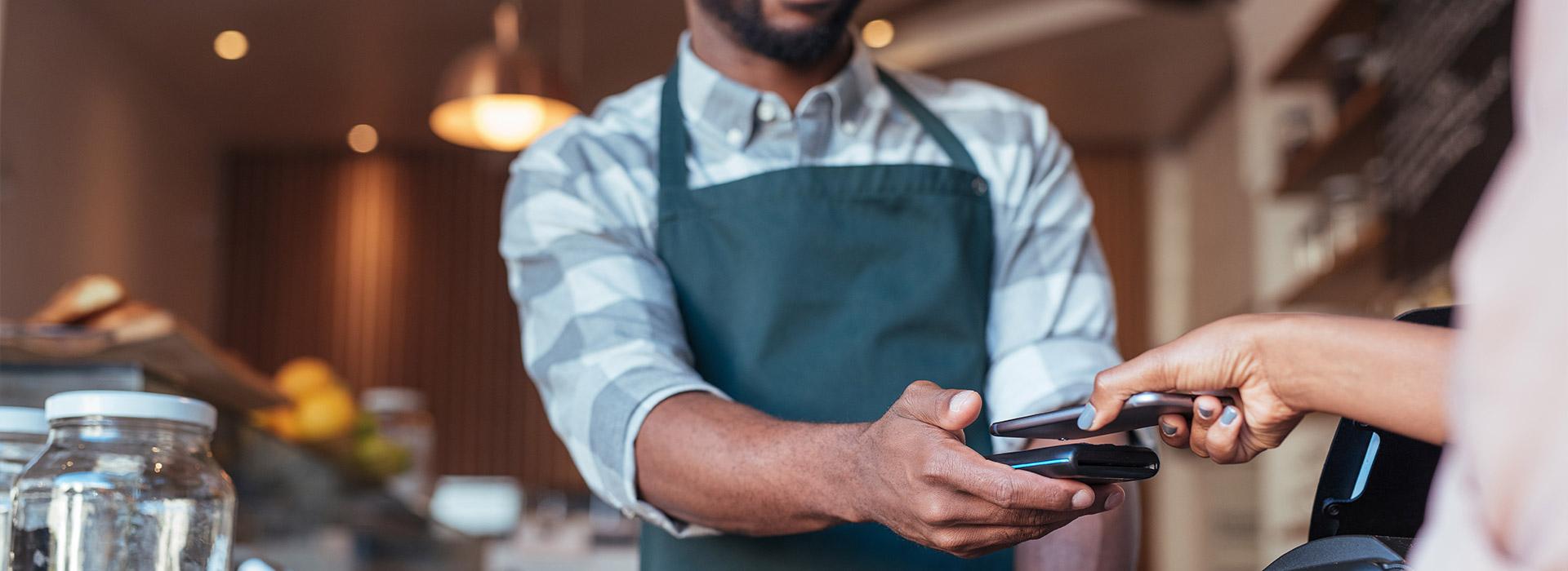 Cell phone held over payment processor