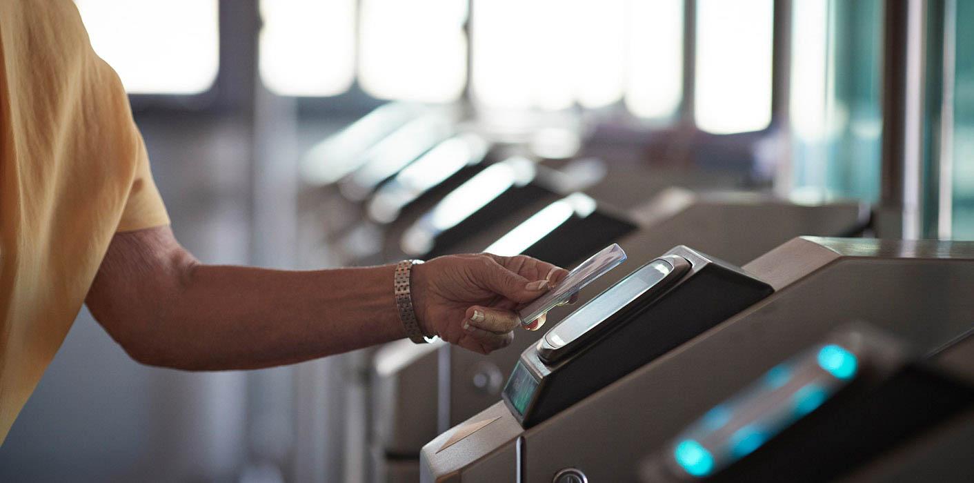 person tapping credit card for payment