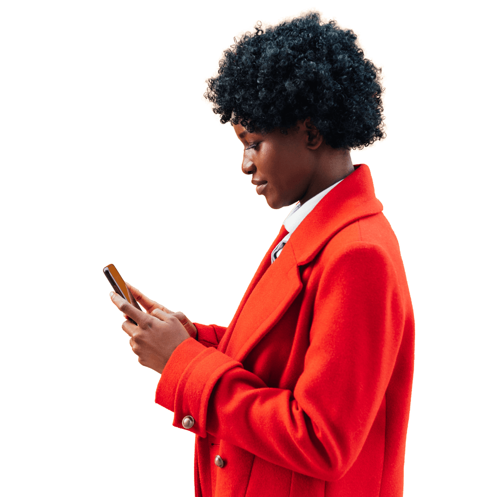 A woman in a red coat with a phone